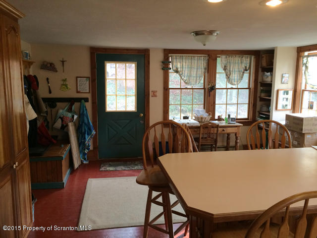 515 High Bridge Road Nicholson, PA 18446 - Photo 8 of 26 a view of a dining room with furniture and a window