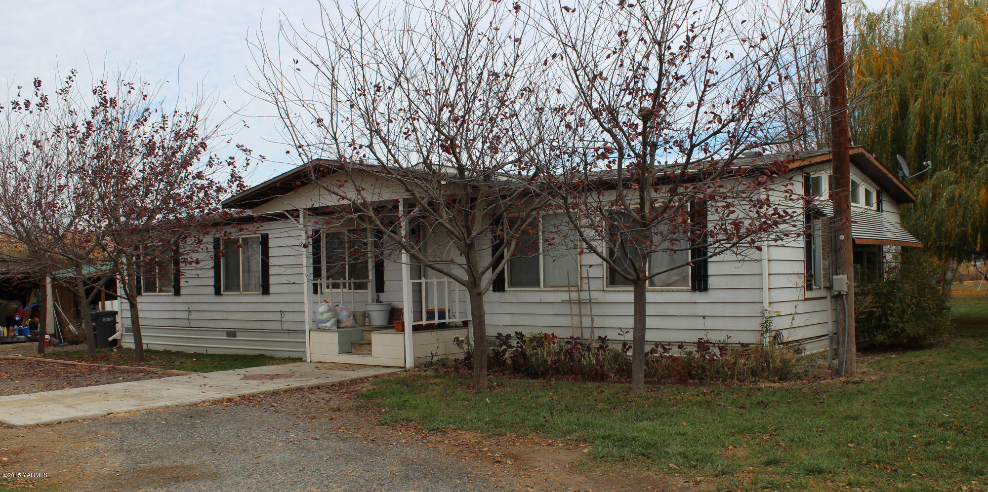 5205 Postma Road Yakima, WA 98901 - Photo 1 of 13 a view of a house with a yard