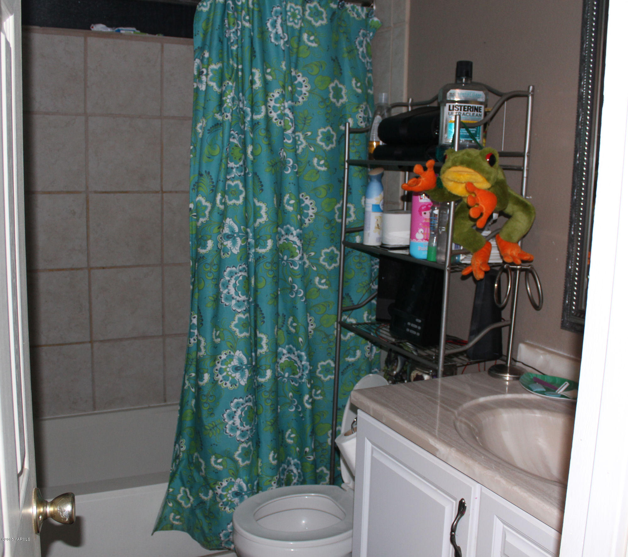 5205 Postma Road Yakima, WA 98901 - Photo 11 of 13 a bathroom with a sink toilet and shower