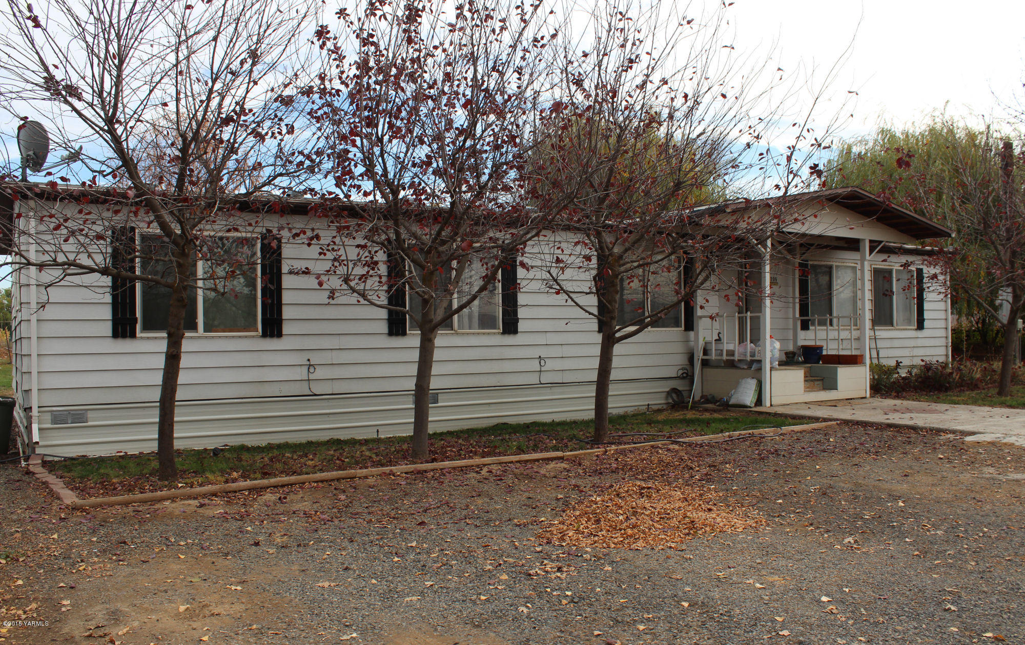 5205 Postma Road Yakima, WA 98901 - Photo 3 of 13 a view of a house with a yard