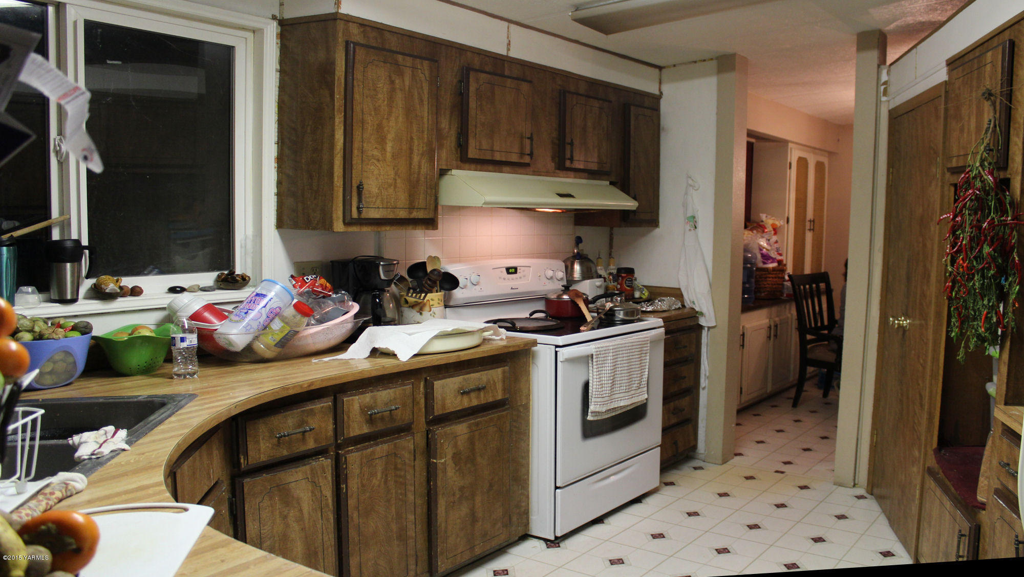 5205 Postma Road Yakima, WA 98901 - Photo 7 of 13 a kitchen with a sink stove and refrigerator