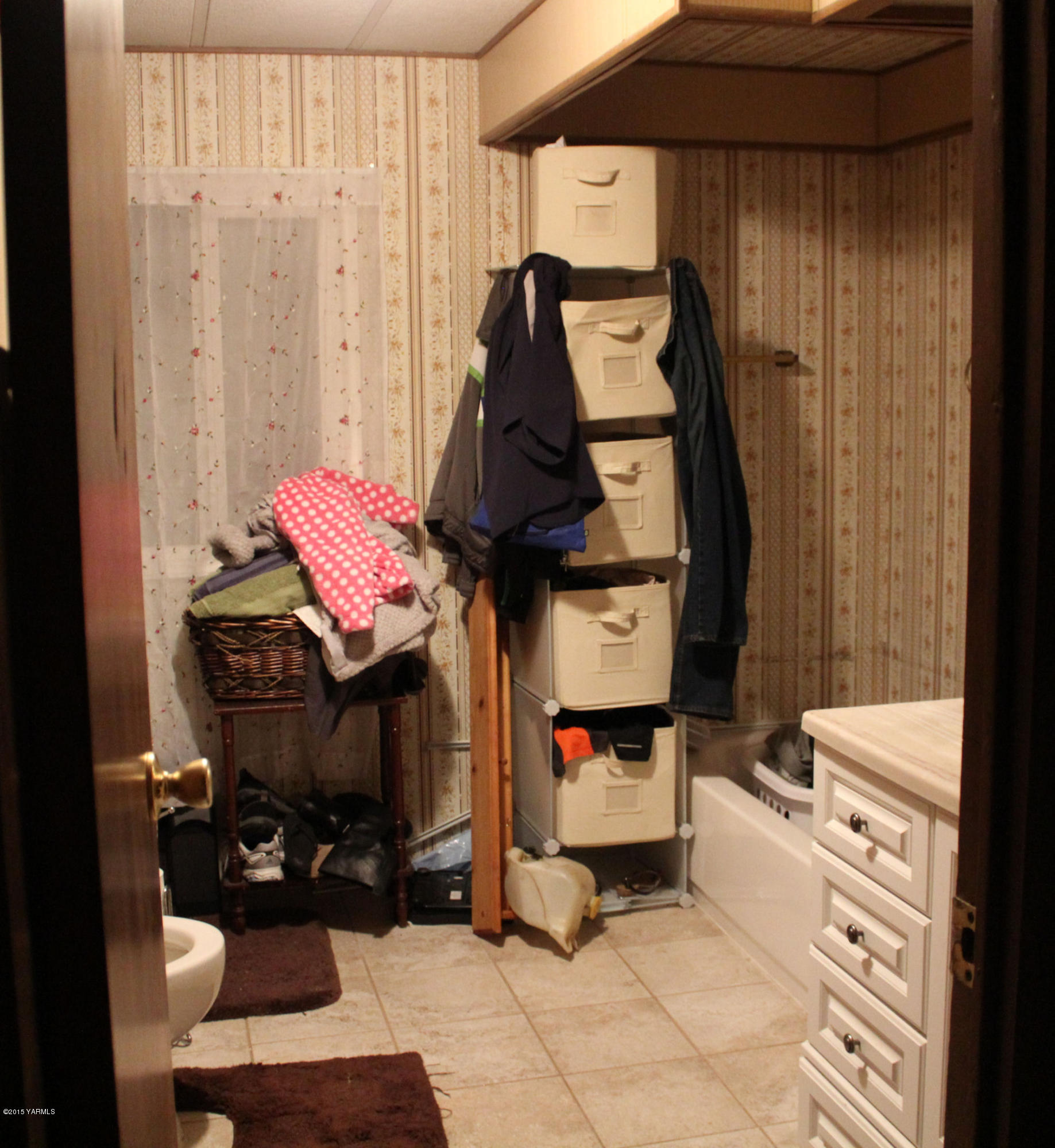 5205 Postma Road Yakima, WA 98901 - Photo 10 of 13 a bedroom with a bed and teddy bear on the dresser