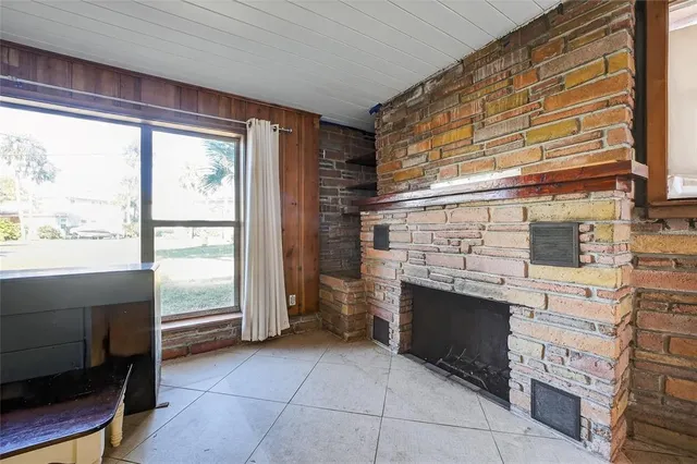 a kitchen with a sink cabinets and window