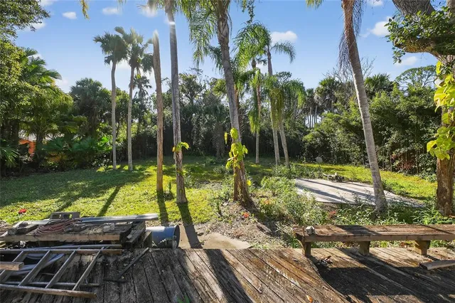 a open kitchen with stainless steel appliances kitchen island a large counter top and a stove
