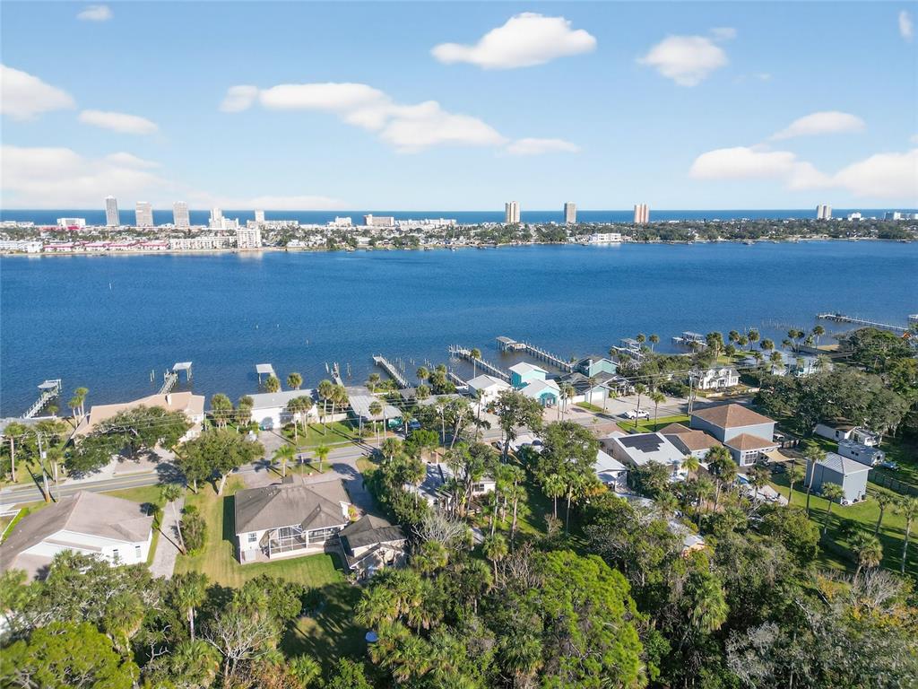 1630 Riverside Drive Daytona Beach, FL 32117 - Photo 59 of 62 an aerial view of a city with lots of residential buildings ocean and mountain view in back