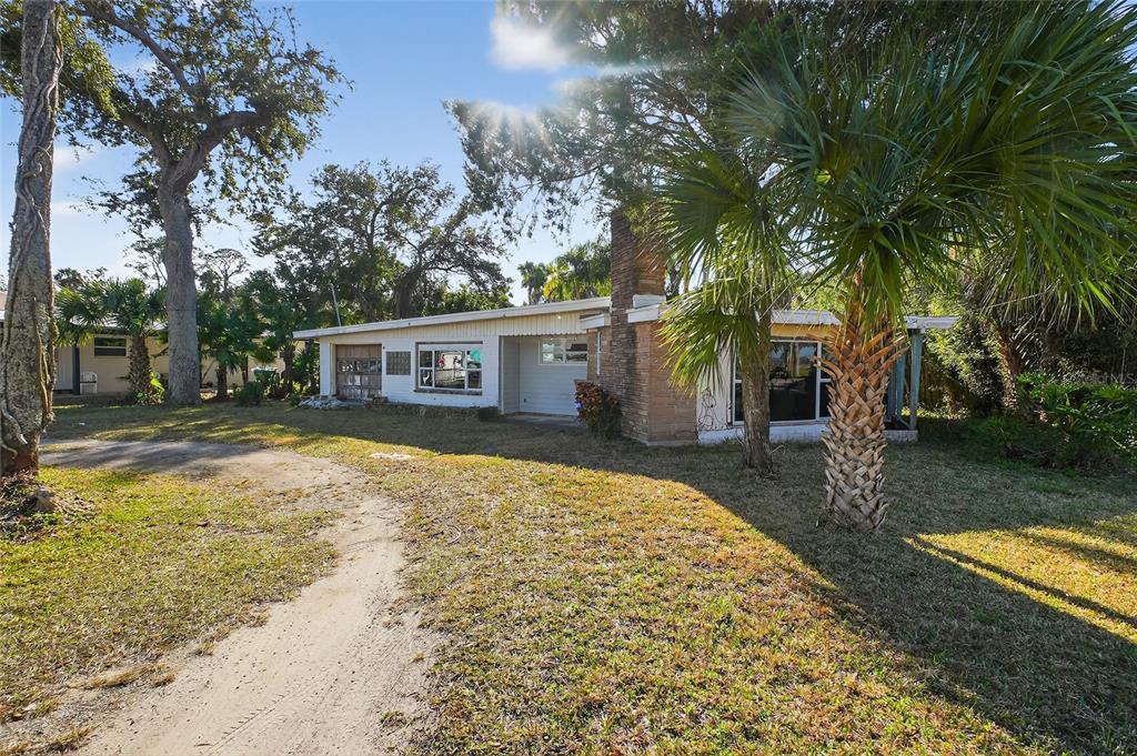 1630 Riverside Drive Daytona Beach, FL 32117 - Photo 7 of 62 a view of a house with backyard and sitting area