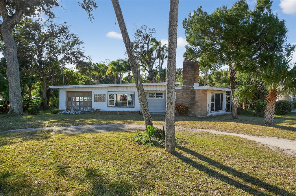 1630 Riverside Drive Daytona Beach, FL 32117 - Photo 9 of 62 a view of a house with a yard