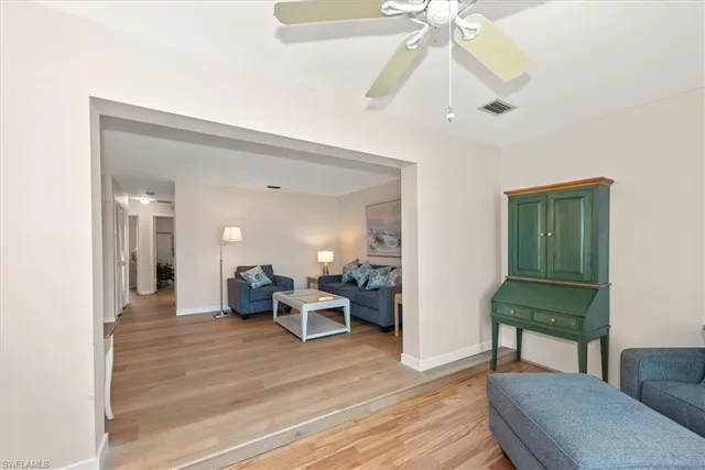 a view of a livingroom with furniture and wooden floor