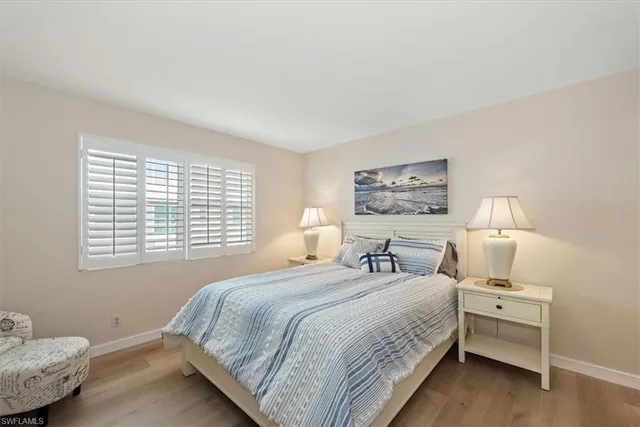 a bedroom with bed and a window