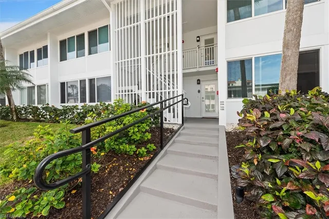 a view of a house with a flower garden