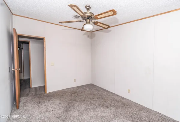 a view of a small space with a fan