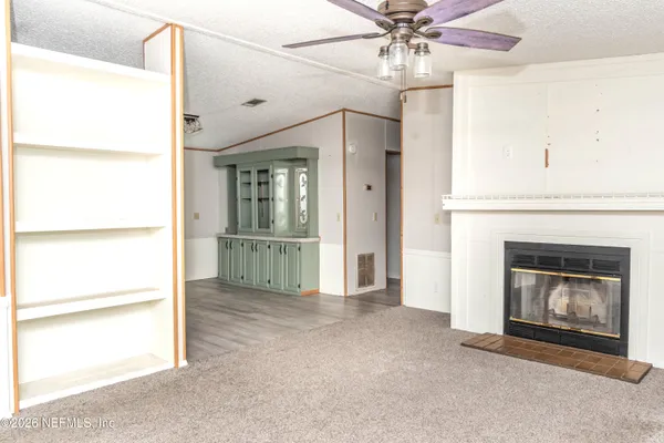 a view of a livingroom with a fireplace