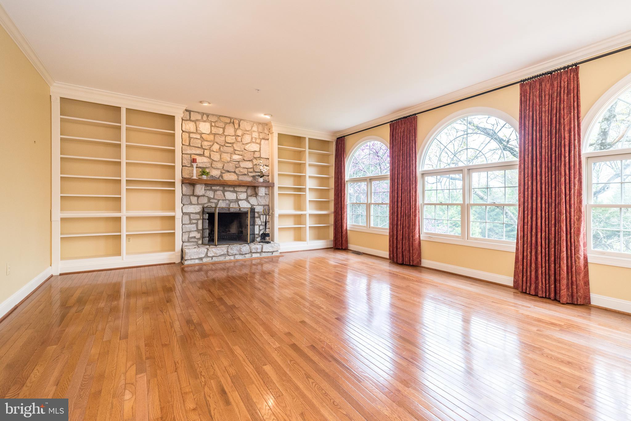 2517 Lockleigh Road Jamison, PA 18929 - Photo 19 of 72 wooden floor fireplace and windows in an empty room