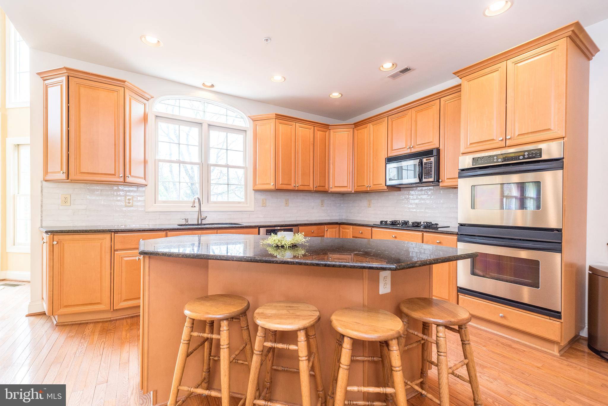2517 Lockleigh Road Jamison, PA 18929 - Photo 25 of 72 a kitchen with stainless steel appliances granite countertop a sink and a stove