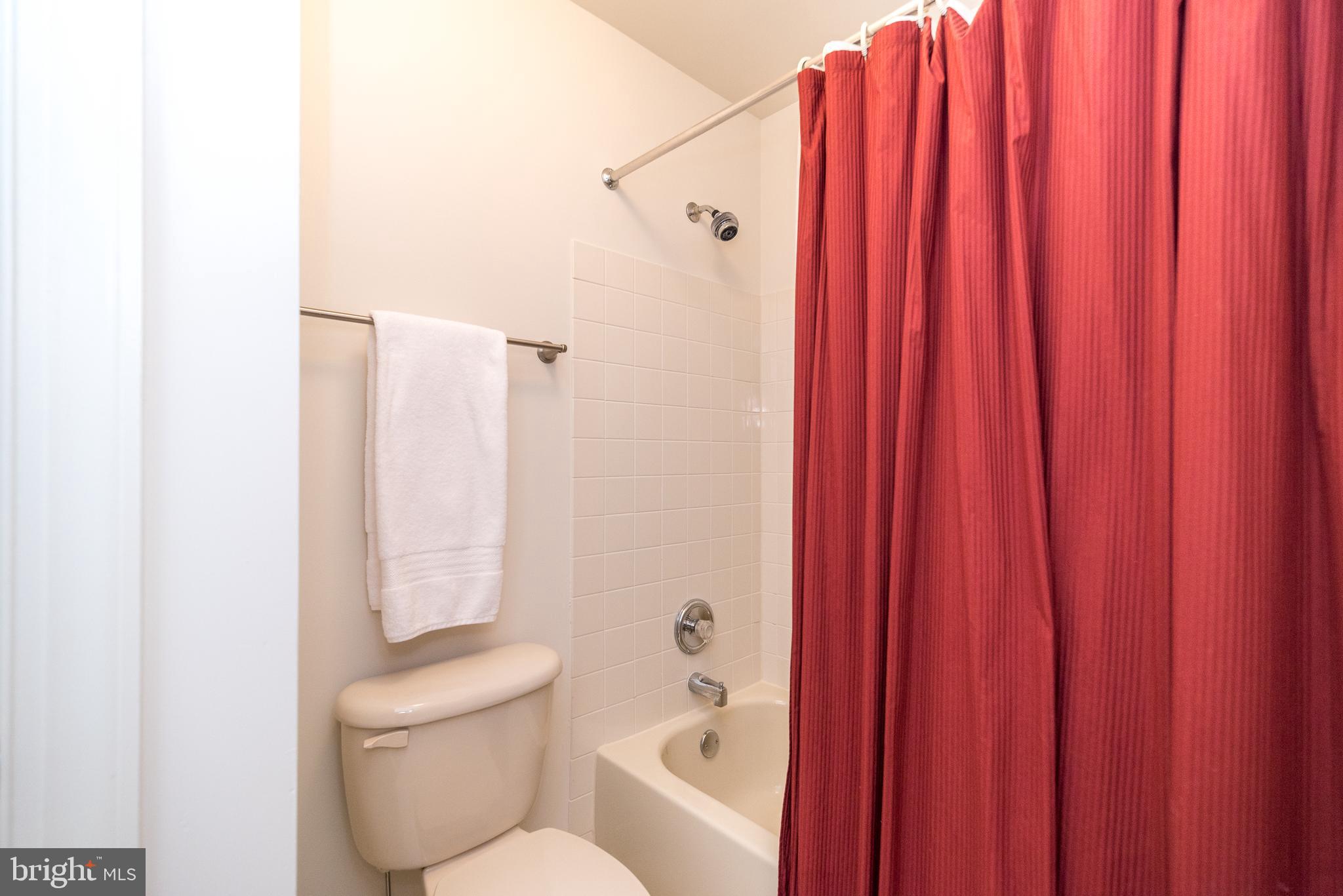 2517 Lockleigh Road Jamison, PA 18929 - Photo 49 of 72 a bathroom with a toilet and shower curtain