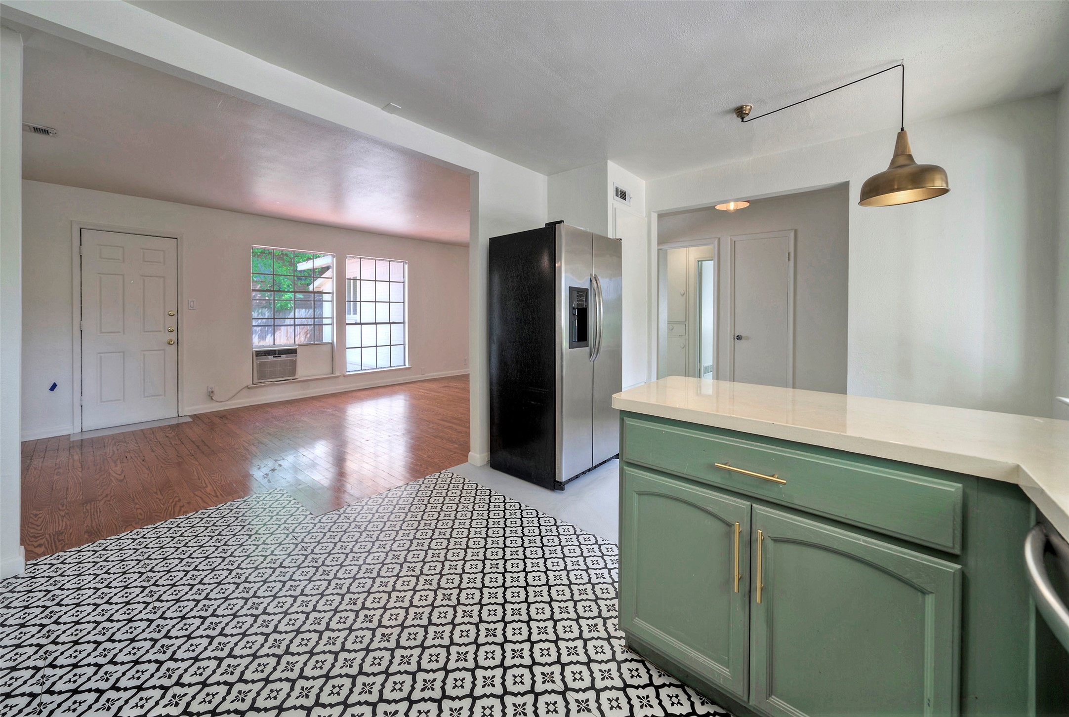 1803 Pearl Street Austin, TX 78701 - Photo 6 of 33 a room with a wooden floor and entryway