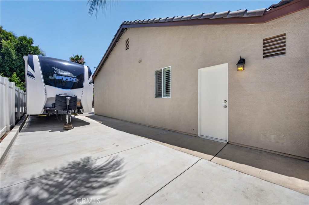 12843 Tarragon Way Riverside, CA 92503 - Photo 44 of 50 80 Ft RV Parking pad behind gates
