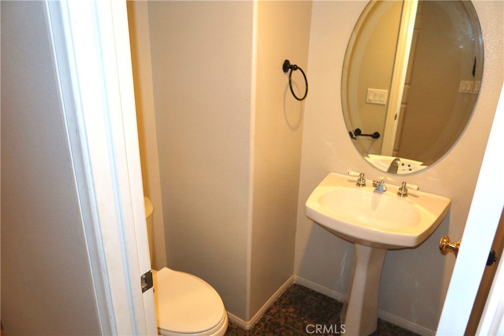2827 Player Tustin, CA 92782 - Photo 19 of 42 a bathroom with a sink mirror and toilet