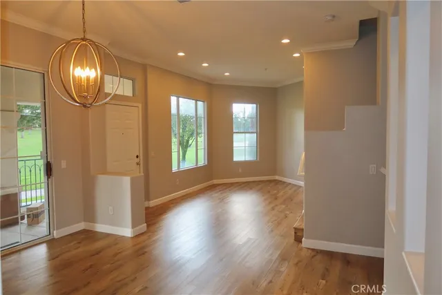 a kitchen with stainless steel appliances a stove a microwave and a sink
