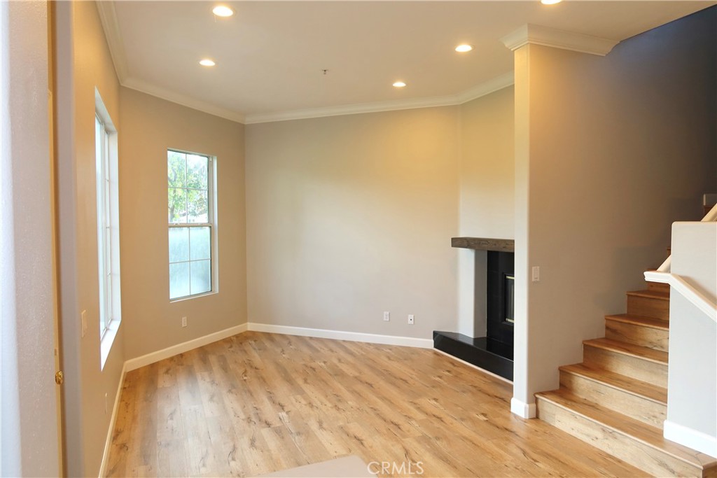 2827 Player Tustin, CA 92782 - Photo 24 of 42 a view of an empty room with wooden floor and a window