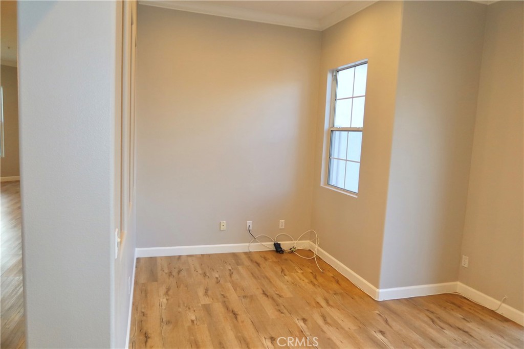 2827 Player Tustin, CA 92782 - Photo 29 of 42 an empty room with wooden floor and windows