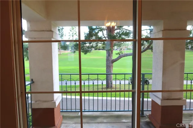 a view of hallway with shower and a window