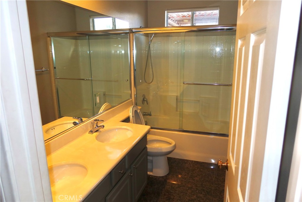 2827 Player Tustin, CA 92782 - Photo 34 of 42 a bathroom with a sink toilet and shower