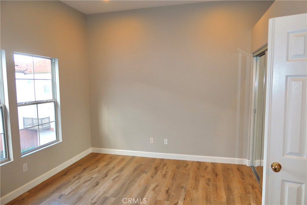 2827 Player Tustin, CA 92782 - Photo 35 of 42 a view of an empty room with wooden floor and a window