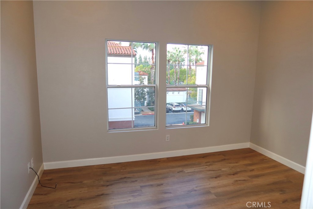 2827 Player Tustin, CA 92782 - Photo 36 of 42 an empty room with wooden floor and windows