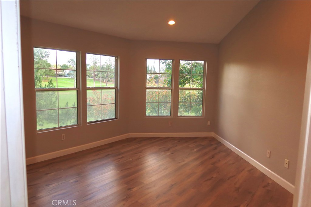 2827 Player Tustin, CA 92782 - Photo 38 of 42 an empty room with wooden floor and windows