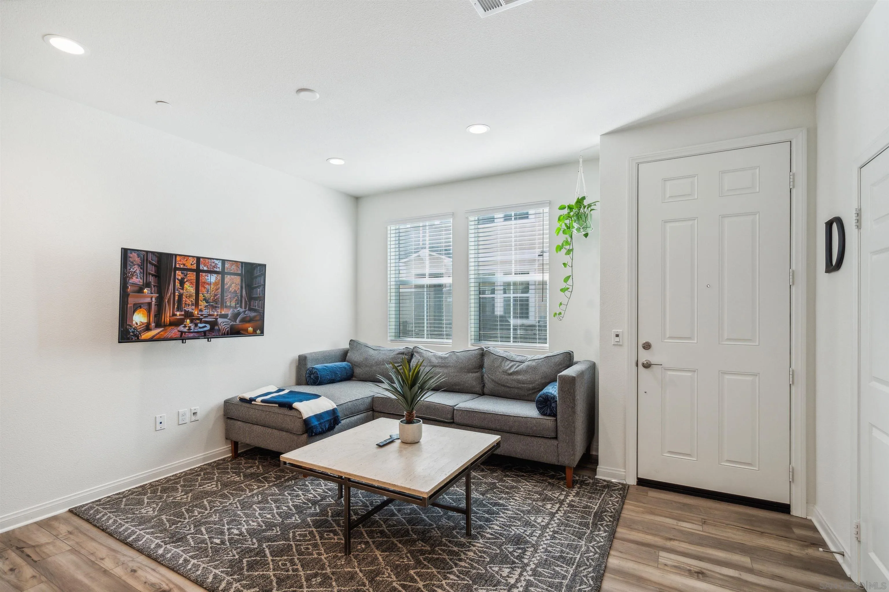 2018 Barite Street Spring Valley, CA 91977 - Photo 16 of 47 a living room with furniture and a rug