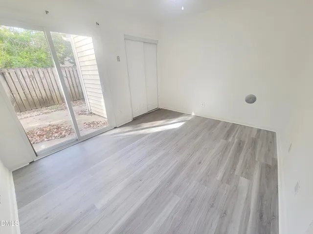 a view of entryway with wooden floor