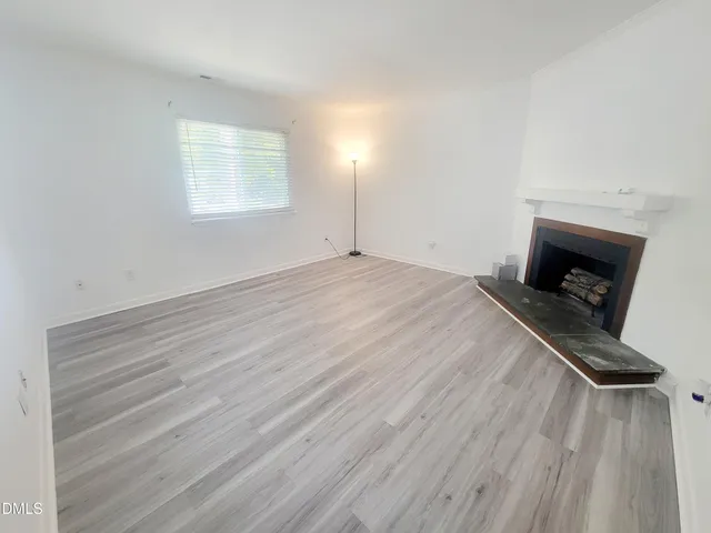 a bedroom with a bed and a fireplace