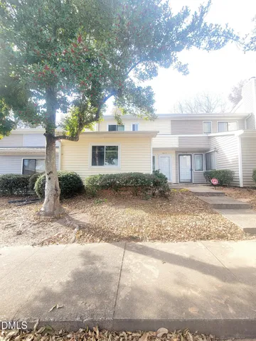 a front view of a house with garage