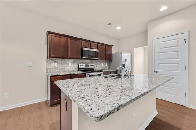 a bathroom with a sink a mirror and vanity