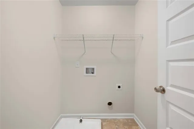 a white bath tub sitting next to a shower