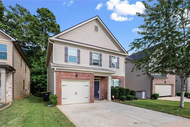 front view of a house with a yard