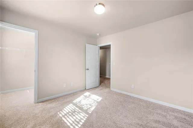 a bathroom with a granite countertop sink mirror and a bathtub
