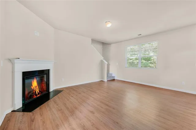 a kitchen with stainless steel appliances kitchen island granite countertop a sink stove and microwave