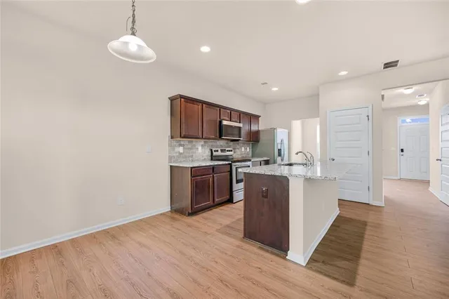 a kitchen with a sink and a window