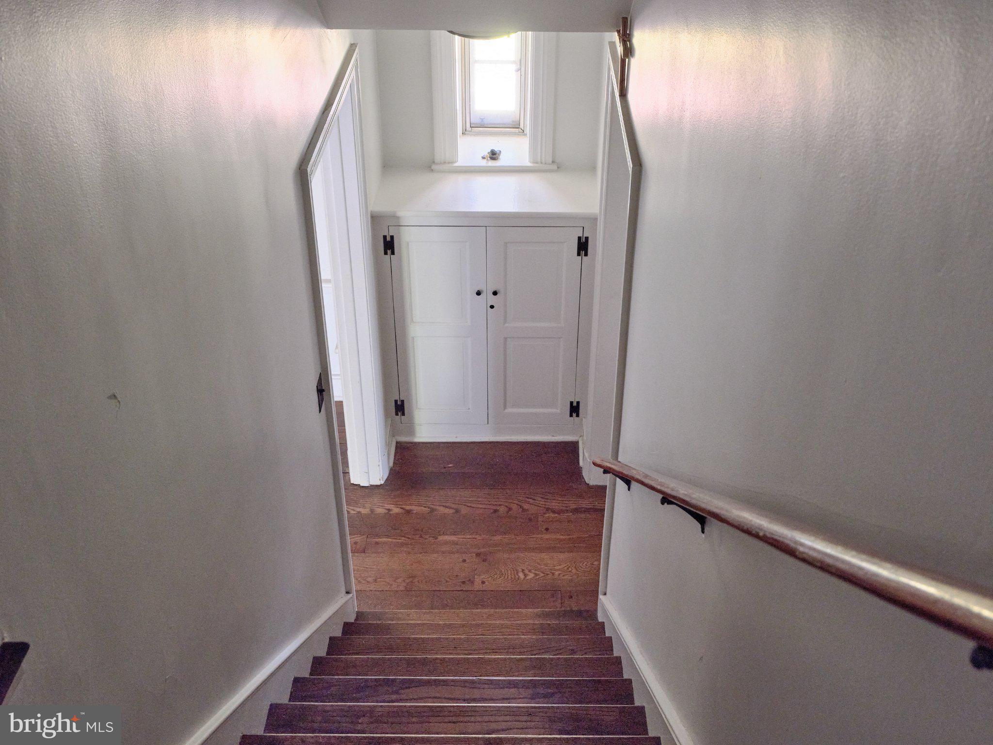 765 Swamp Road Newtown, PA 18940 - Photo 24 of 37 a view of a hallway with wooden floor and staircase