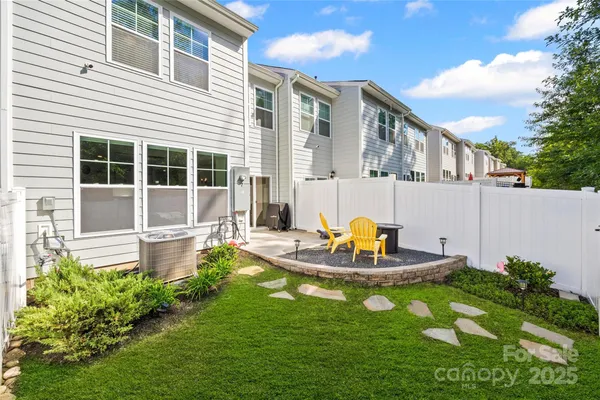 a house view with a sitting space and garden