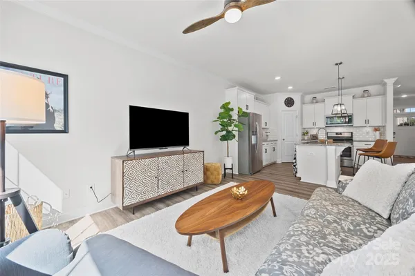 a living room with furniture and a flat screen tv