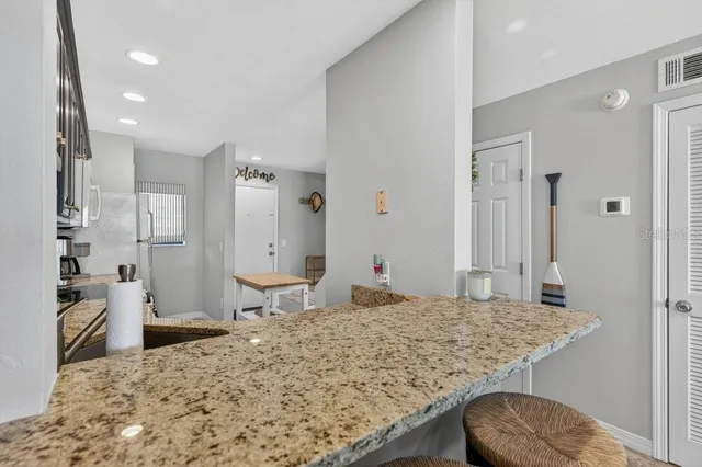 a bedroom with a bed and a stove top oven