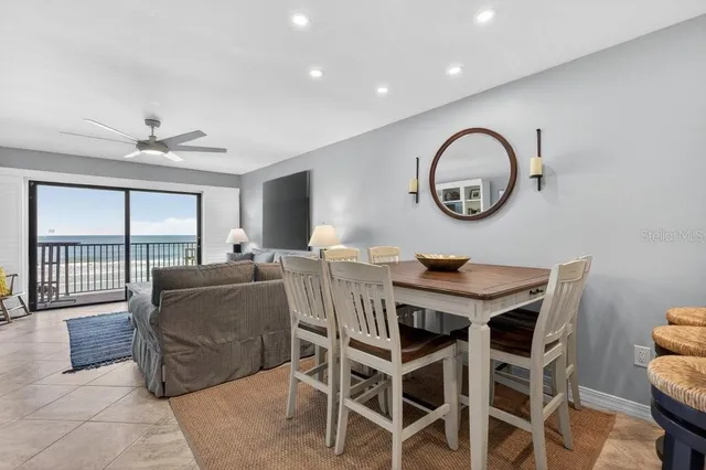 a living room with furniture a window and a clock