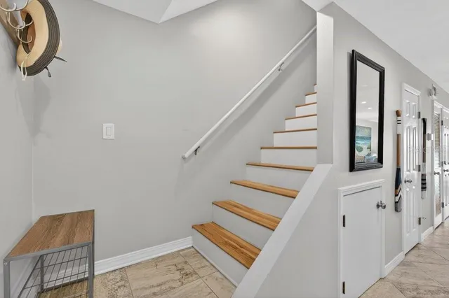 a view of entryway with stairs and furniture