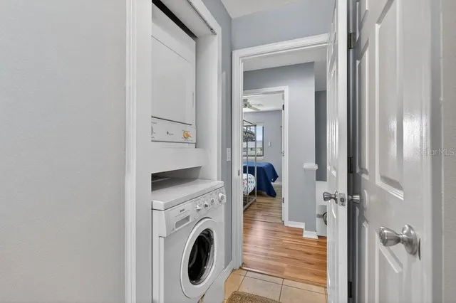 a view of a hallway with washer and dryer