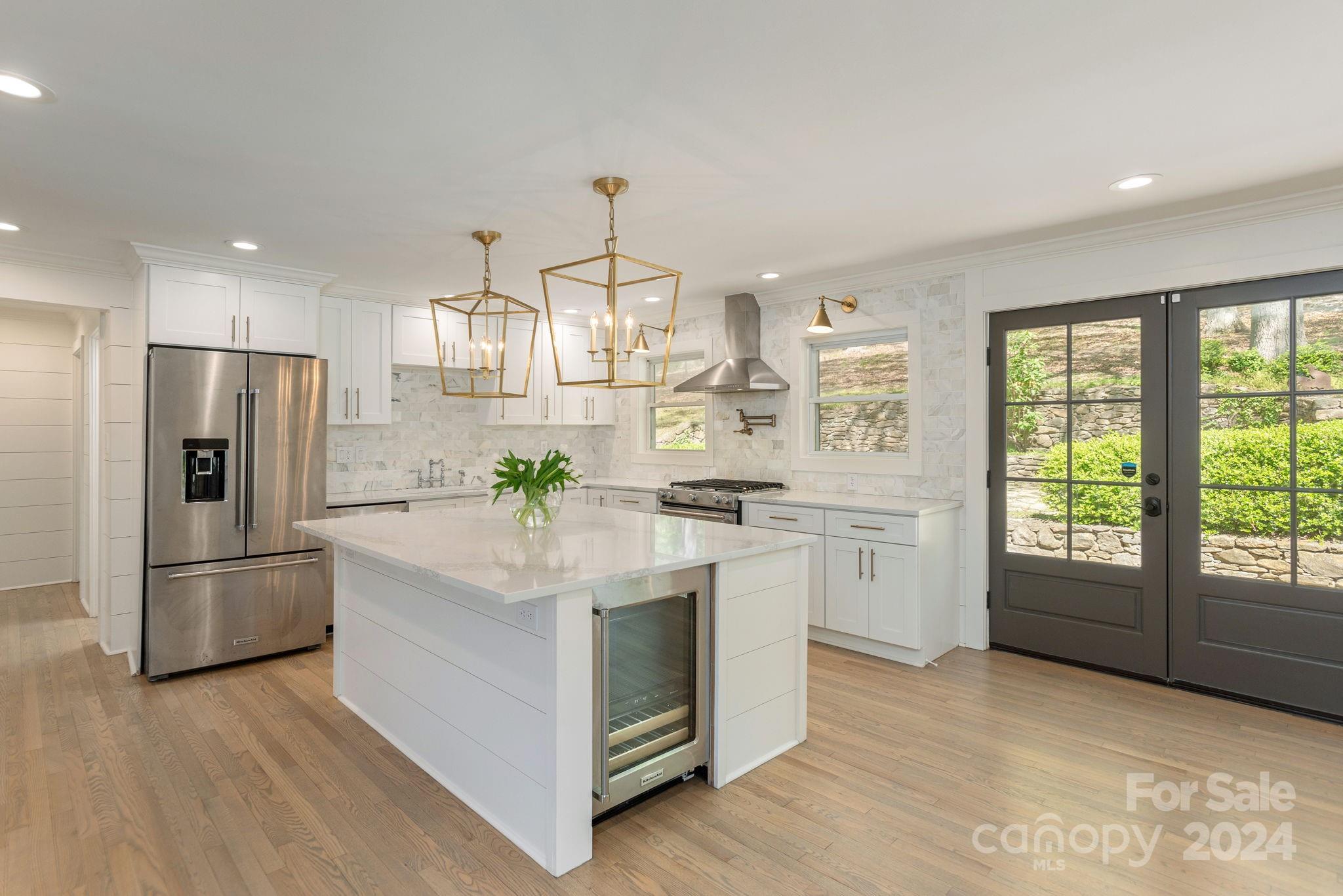 51 Forest Road Asheville, NC 28803 - Photo 12 of 45 a kitchen with a refrigerator and a stove top oven