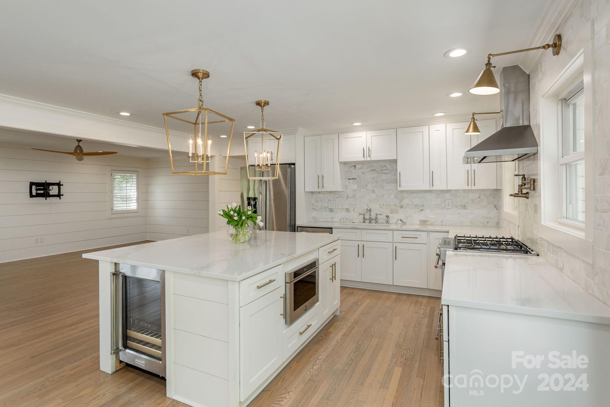 51 Forest Road Asheville, NC 28803 - Photo 14 of 45 a kitchen with a stove a sink and a refrigerator