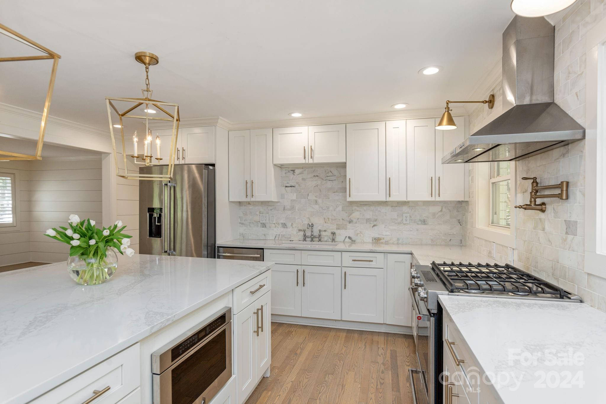 51 Forest Road Asheville, NC 28803 - Photo 15 of 45 a kitchen with a sink and stove